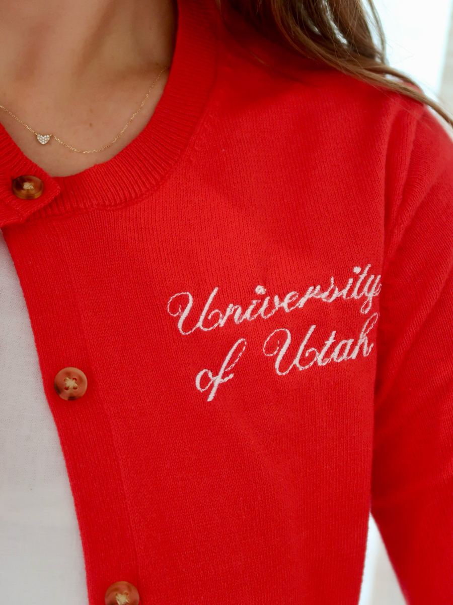 Red cardigan with white University of Utah script